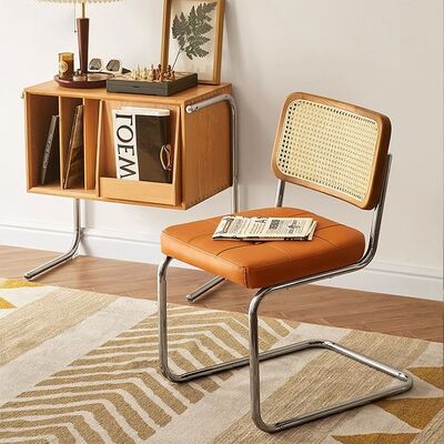 قیمت خوب Simple Comfortable Solid Wood Home Dining Chair Stainless Steel  Conference Cafe Rattan Leisure Chair آنلاین